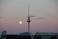 Moon rise behind T.V tower Alexanderplatz Royalty Free Stock Photo