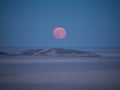 The moon rise from the horizon shortly after sunset Royalty Free Stock Photo
