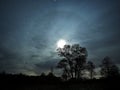 Moon rise halo night sky stars and clouds observing autumn landscape Royalty Free Stock Photo