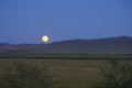 Moon rise up at in Inner Mongolia grassland Royalty Free Stock Photo