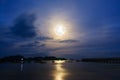 Moon rises over the fishing pier. Royalty Free Stock Photo