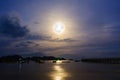 Moon rises over the fishing pier. Royalty Free Stock Photo