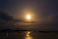 Moon rises over the fishing pier. Royalty Free Stock Photo