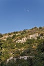 The Moon rises over the rocky necropolis of Pantalica in Sicily Royalty Free Stock Photo