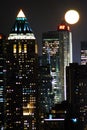 The moon rises over the skyscrapers of Manhattan Royalty Free Stock Photo