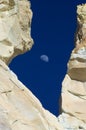 Moon rises between two sandstone towers, Utah