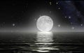 Moon rising over the ocean Royalty Free Stock Photo