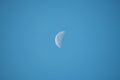 The  moon is seen in the sky during the day Royalty Free Stock Photo