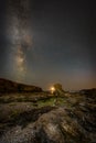 Moon Set with Milky Way over Porth Y Post. Royalty Free Stock Photo