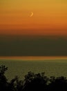 Moon set and orange sky after sunset