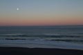 Moon setting on the pacific coast Royalty Free Stock Photo