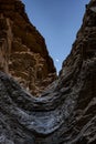 Moon Settles In a Deep V of Rock Above Mosaic Canyon Dry Fall