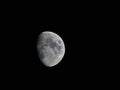 Moon shining pale light in the night sky Royalty Free Stock Photo