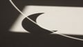 Crescent Moon Shadow Cast on White Surface with Line photo Royalty Free Stock Photo