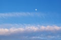 The moon in the sky in the daytime with the cloud against the blue sky background. Natural background Royalty Free Stock Photo