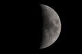 Moon almost in the third quarter phase Royalty Free Stock Photo