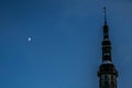 The moon and tower on background of blue sky , Tallinn Royalty Free Stock Photo