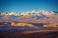 Moon Valley in Atacama desert at sunset, snowy Andes mountain range in the background, Chile Royalty Free Stock Photo