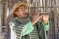 Moon Valley, Bolivia, 01162023 - Man plays homemade flute