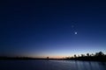 Moon, Venus, Orion over Pine Glades Lake in late evening twilight.