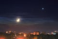 Moon and Venus over the town Royalty Free Stock Photo