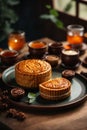 Mooncake on table with tea cups on wooden background and full moon, Mid-Autumn Festival concept