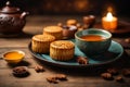 Mooncake on table with tea cups on wooden background and full moon, Mid-Autumn Festival concept