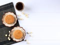 Mooncake on White Background with Tea. Concept Moon Cake on Mid Autumn Festival or Chinese New Year. Mooncake Popular as Kue Bulan