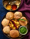 Moong dal kachori and potato curry with mint chutney Royalty Free Stock Photo