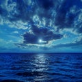 Moonlight in clouds over water Royalty Free Stock Photo