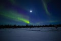 Moonlight over Curtains, Rays and Pillars of Northern Lights in Winter