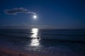 Moonlight path on water of Atlantic ocean at night on Tenerife and dark blue sky with full Moon and stars Royalty Free Stock Photo