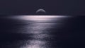 Moonlight reflected in a a calm ocean