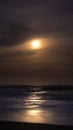 Moonlight reflected on ocean at night. Long exposure. Royalty Free Stock Photo