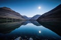 moonlight reflecting off tranquil mountain lake