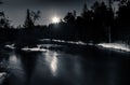 Moonlight Reflection over Winter River Snow on Banks Royalty Free Stock Photo