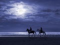 Moonlit Beach and Horseriders Royalty Free Stock Photo