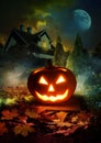 Moonlit pathway to haunted house, patio with Jack-o-Lantern Royalty Free Stock Photo