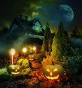 Moonlit pathway to haunted house, patio with Jack-o-Lanterns Royalty Free Stock Photo