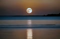 Moonlit Serenade: Tranquil Supermoon Over Water