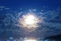 Moonlit sky over tranquil sea, with clouds adding mystical beauty