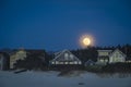 Moonrise above beach houses