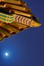 Moonrise above the old pagoda on Jingshan hill in Beijing