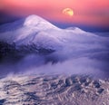 Moonrise among alpine peaks