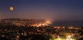 Moonrise of a full moon over the coastline of Laguna Beach Royalty Free Stock Photo