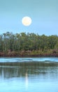 Moonrise over River leading to the ocean at Pass Royalty Free Stock Photo