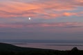 Moonrise over the St Lawrence river while sunset Royalty Free Stock Photo