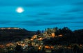 Moonset behind the hill of Chatillon d'Azergues, Beaujolais, France