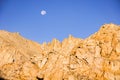 Moonset behind a rocky mountain at sunrise, Eastern Sierra Mountains, Mount Whitney Trail,California