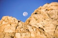 Moonset behind a rocky mountain at sunrise, Eastern Sierra Mountains, Mount Whitney Trail,California